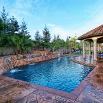 Pool raised planter w diamon tile, brick coping and flagstone stamp earth tone