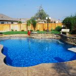 Pool spa stamped concrete raised planter lighter color concrete